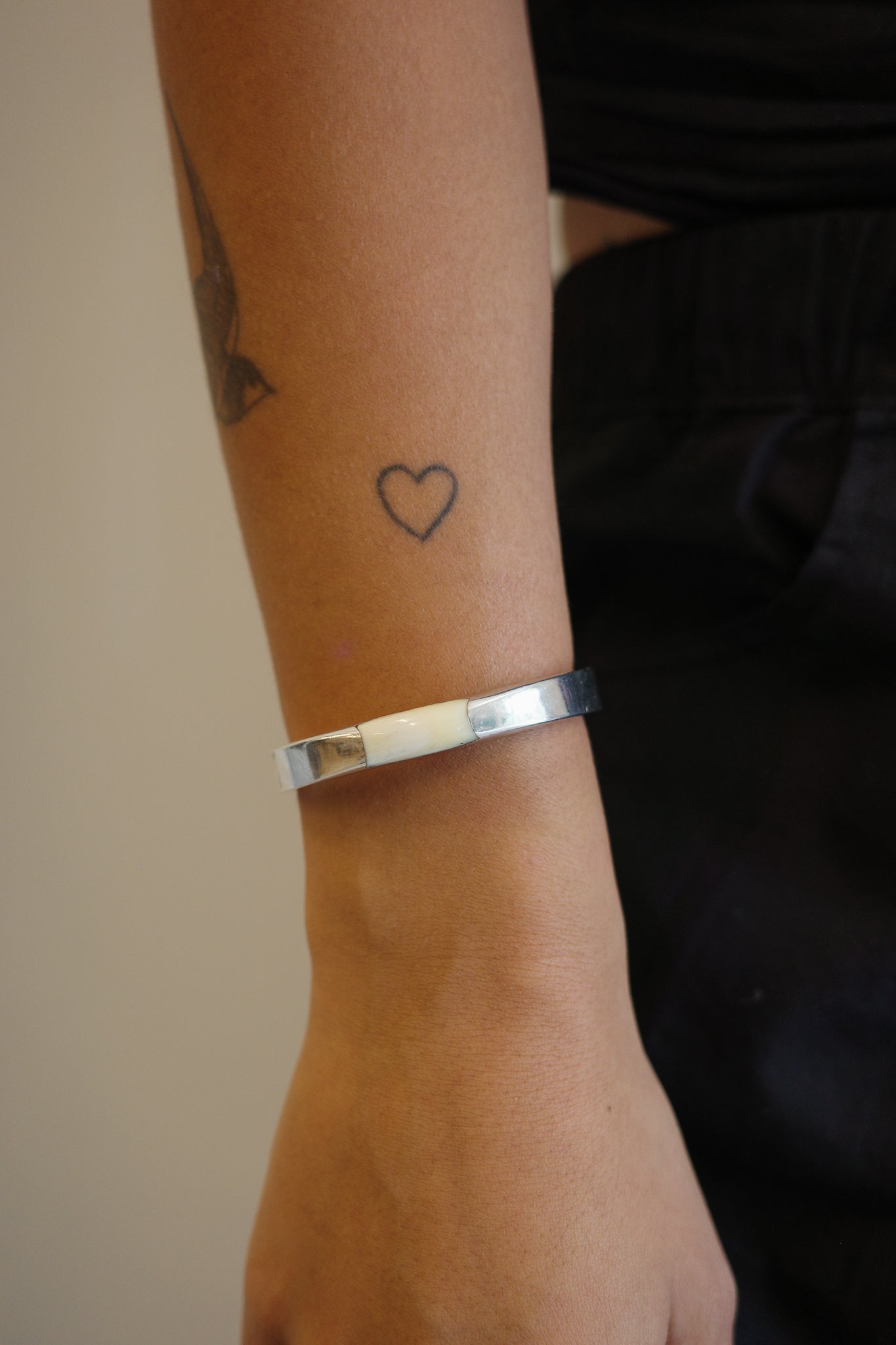 Silver cuff with a soft ivory inlay
