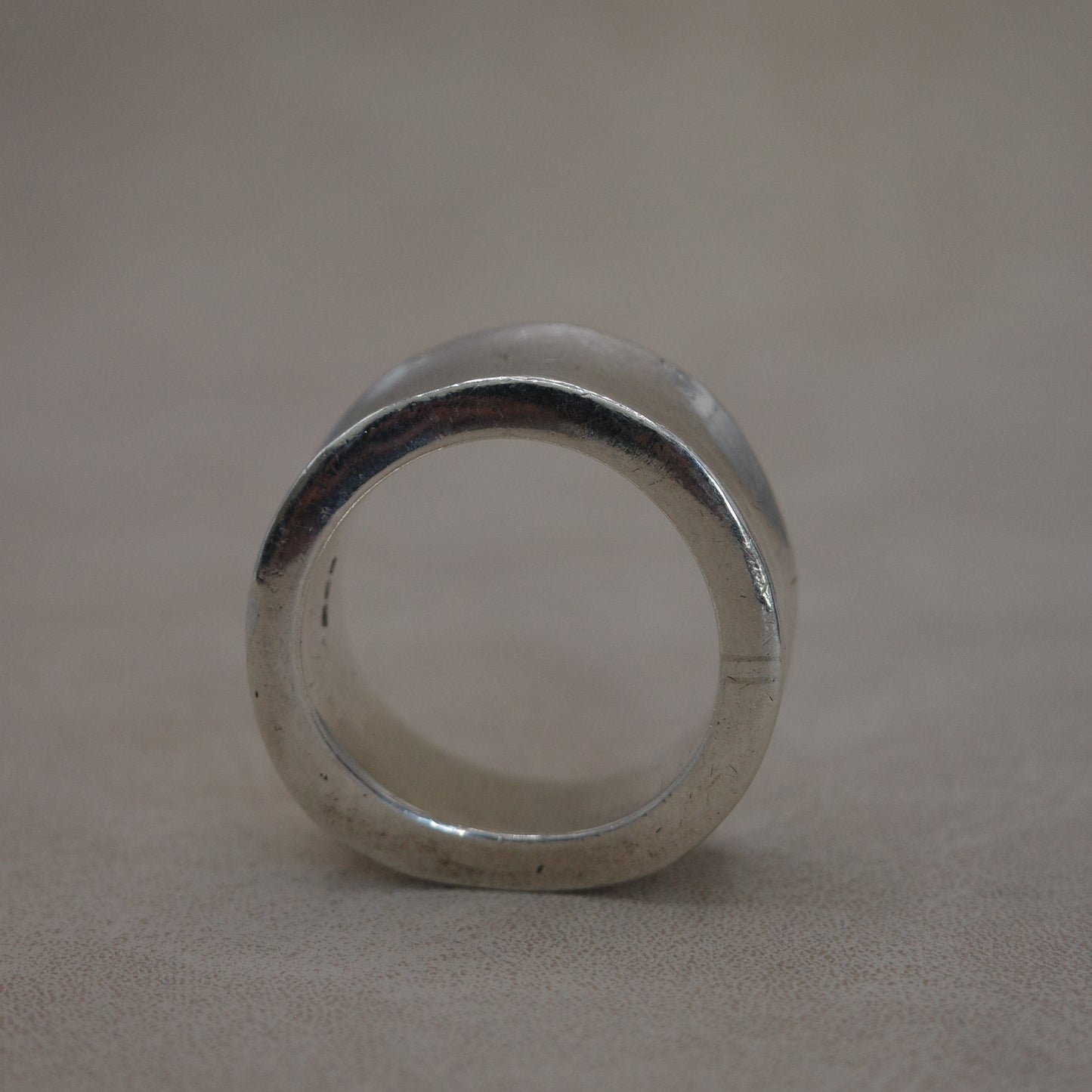 Solid wave band ring with sharp edges