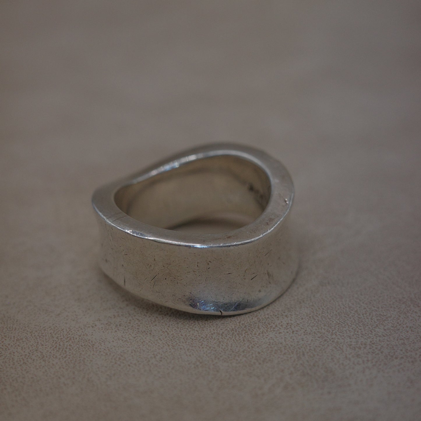 Solid wave band ring with sharp edges