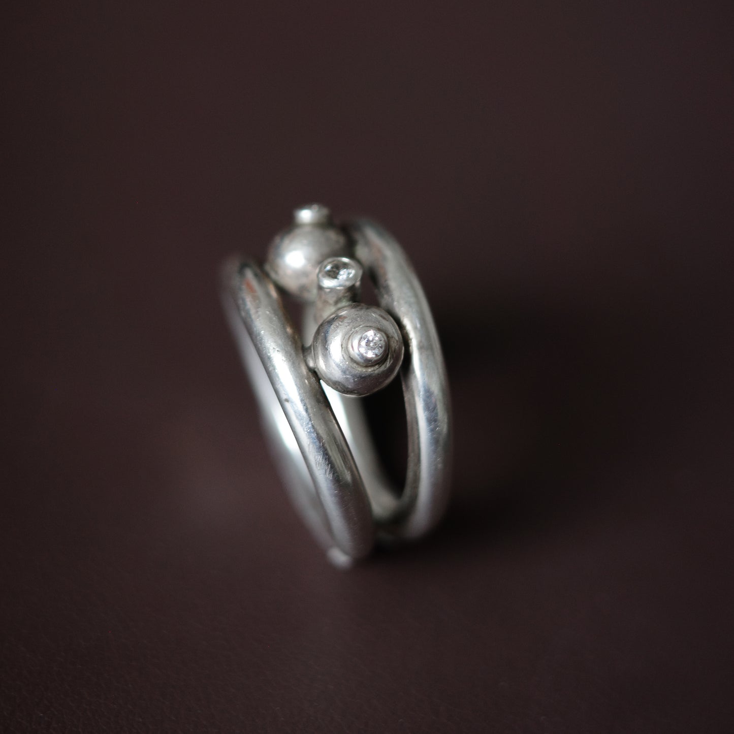Studio-crafted three orbit ring