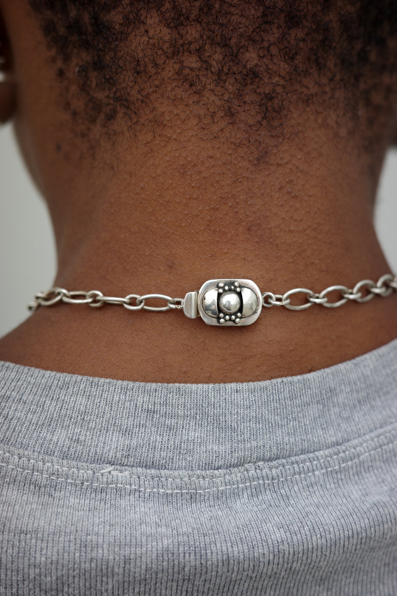 Antique chain with adorned box closure clasp