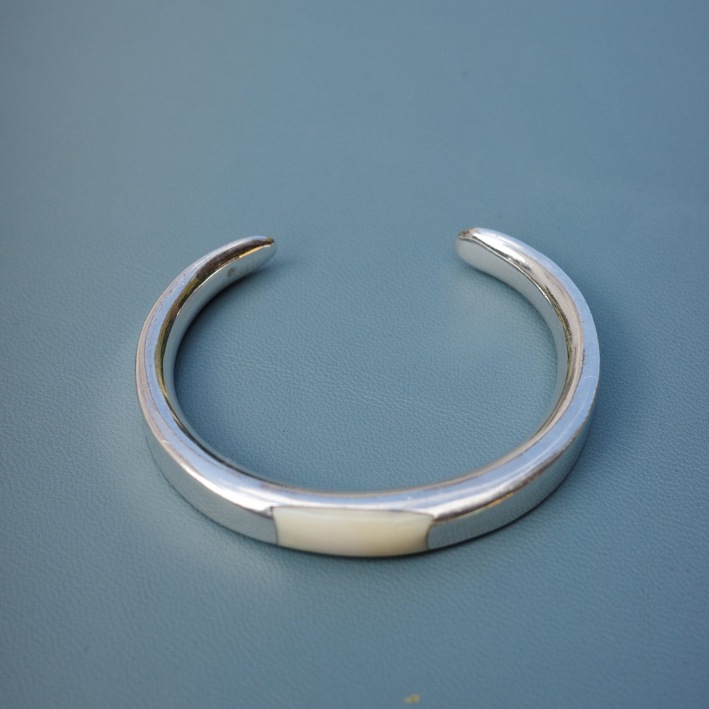 Silver cuff with a soft ivory inlay