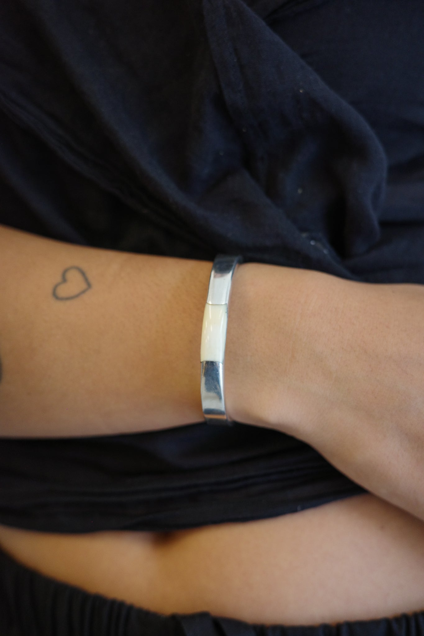 Silver cuff with a soft ivory inlay