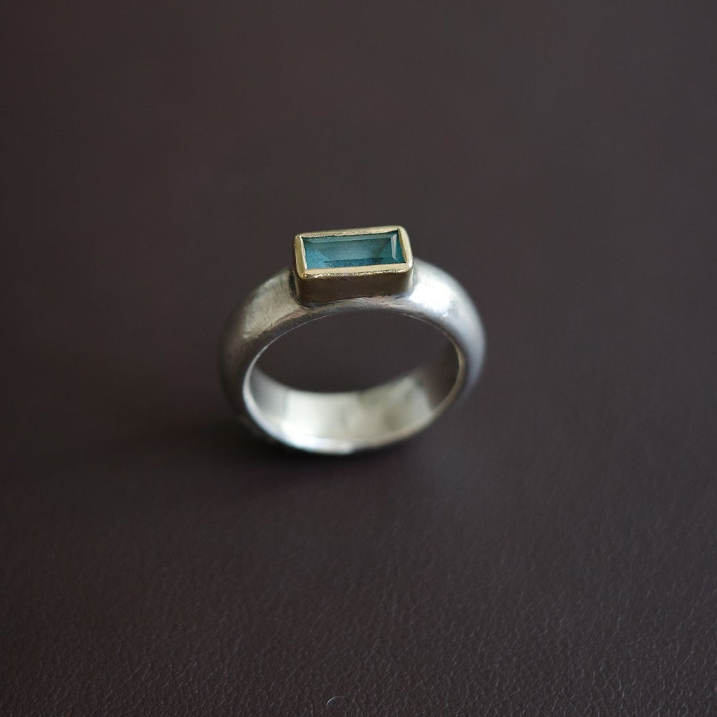 Aquamarine with golden rim ring