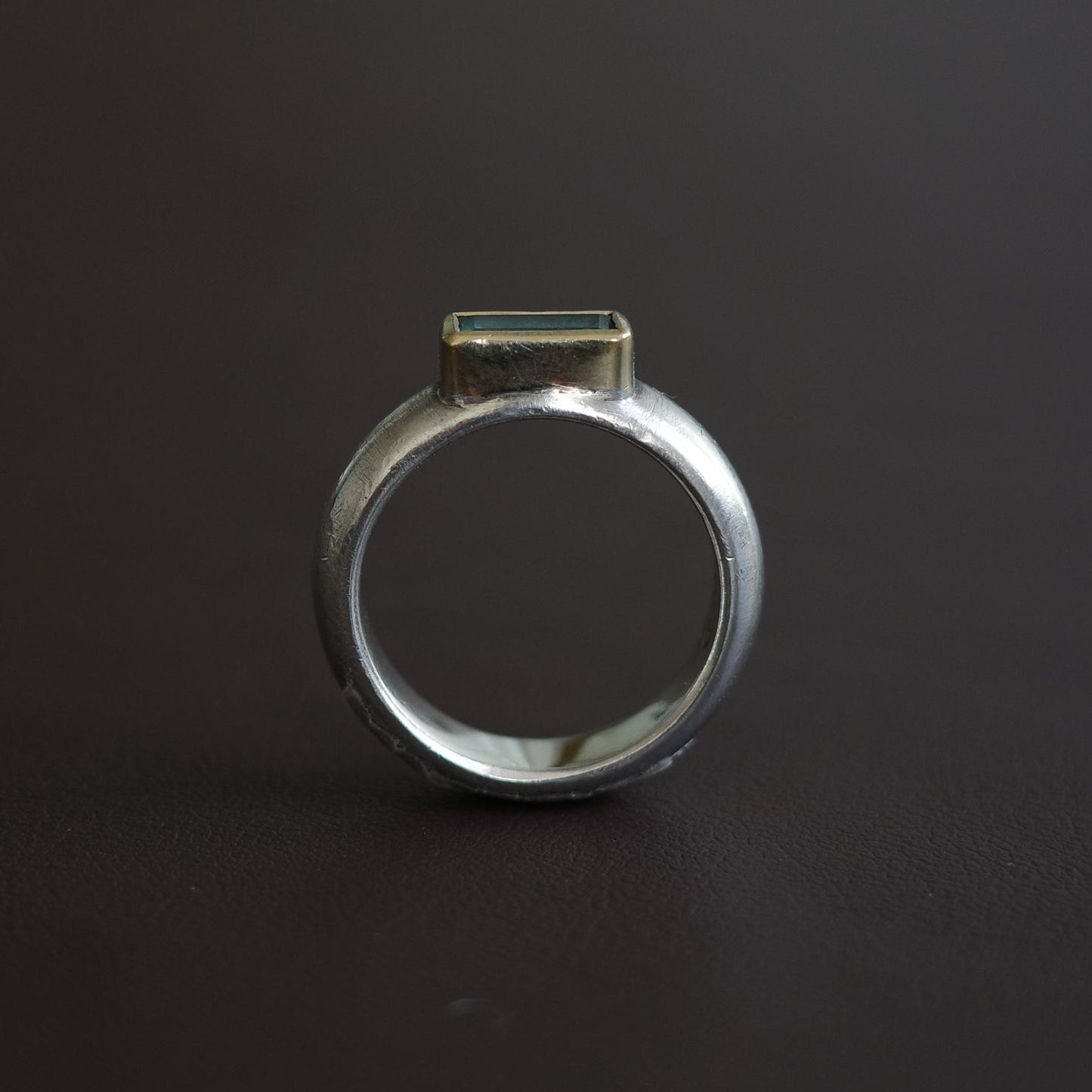 Aquamarine with golden rim ring