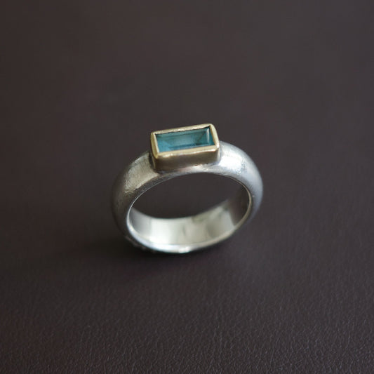Aquamarine with golden rim ring