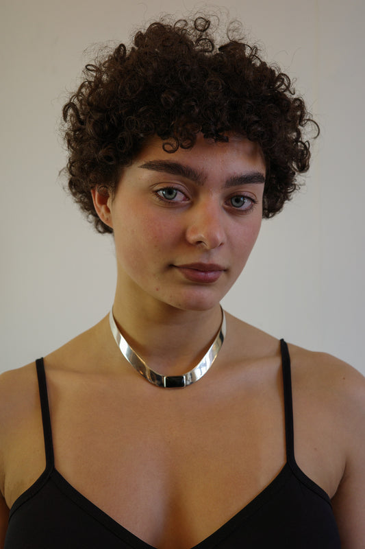 silver neck-piece with onyx stone