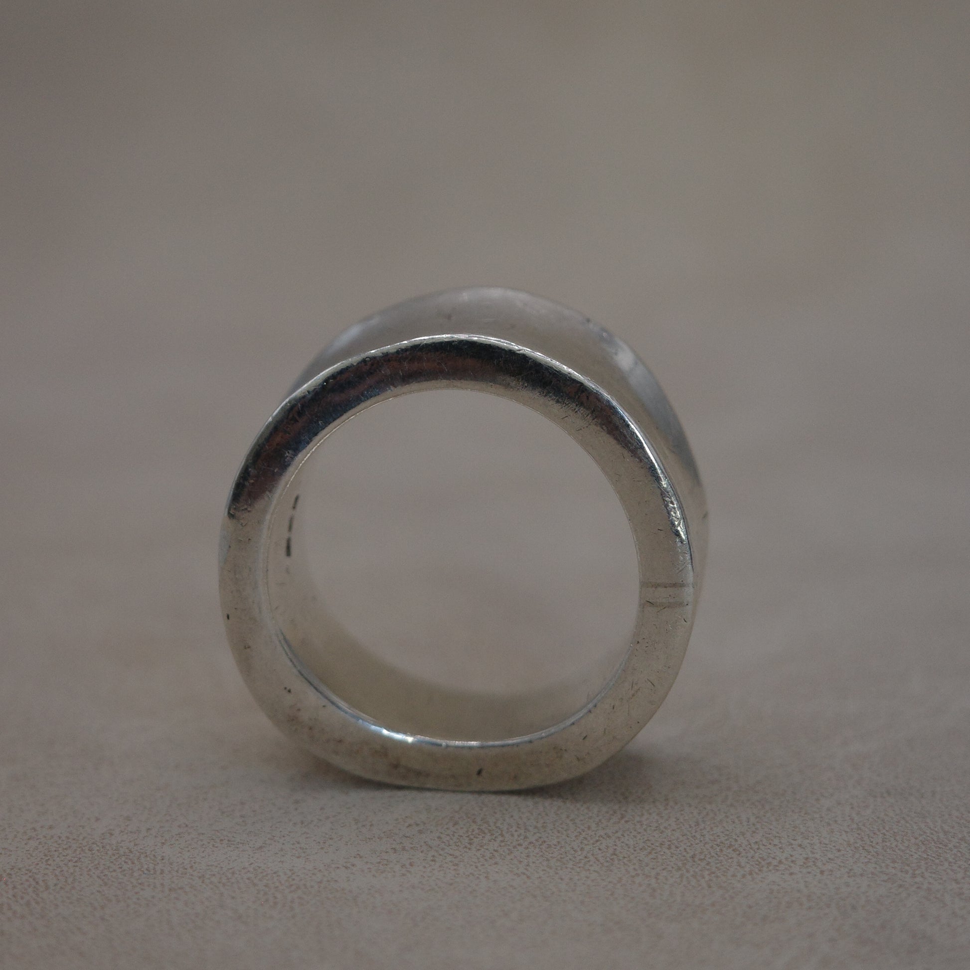 Solid wave band ring with sharp edges