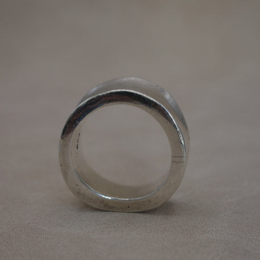 Solid wave band ring with sharp edges