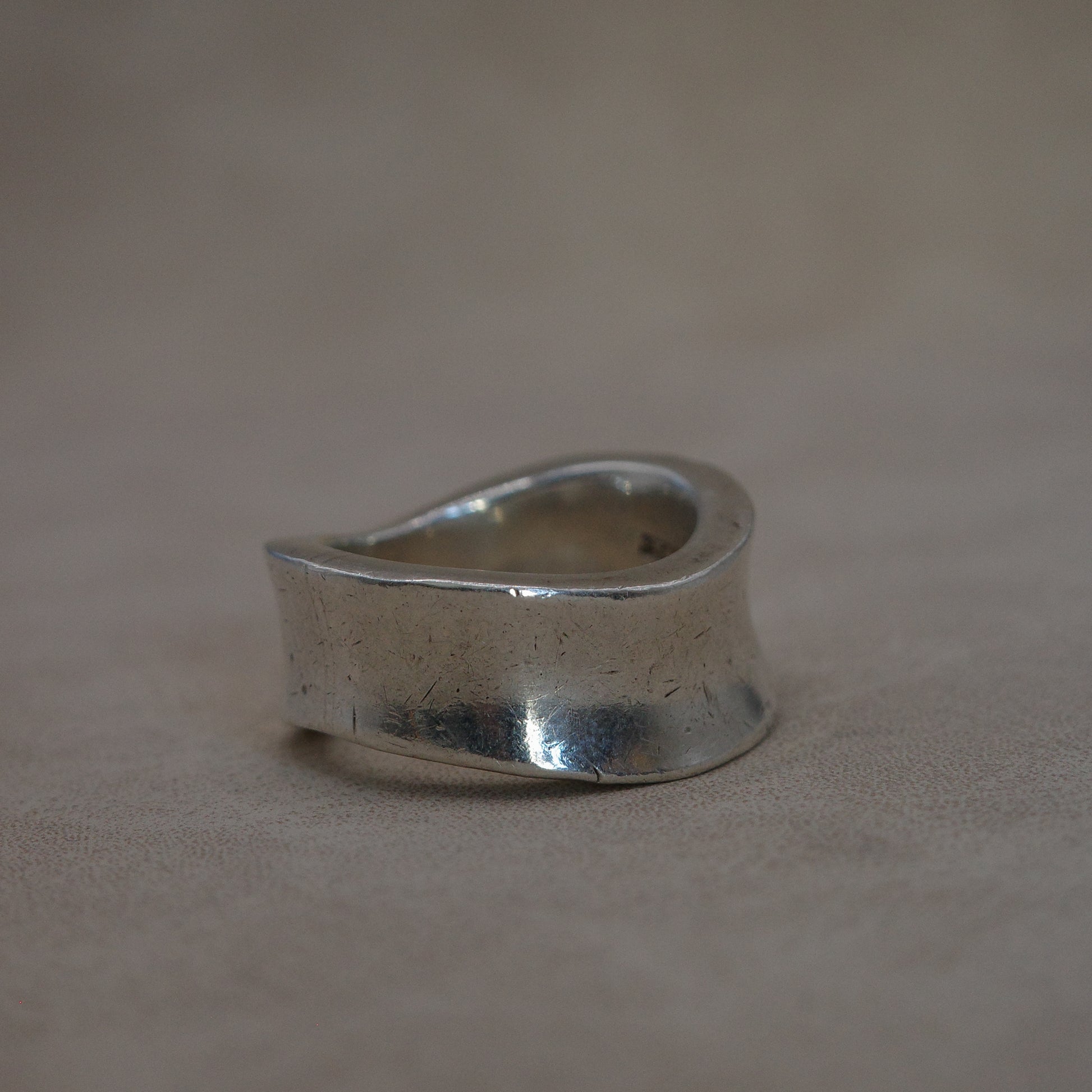 Solid wave band ring with sharp edges