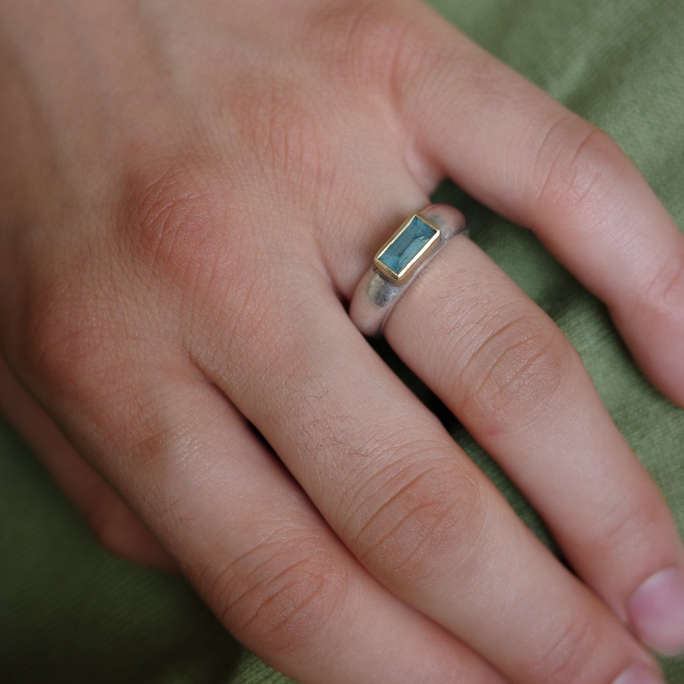 Aquamarine with golden rim ring