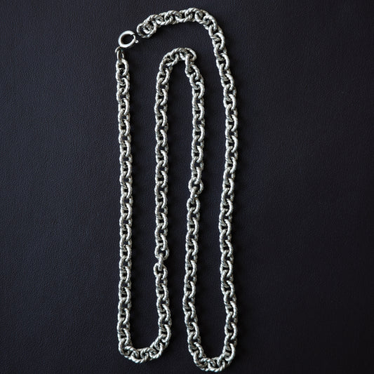 Twisted cable link chain