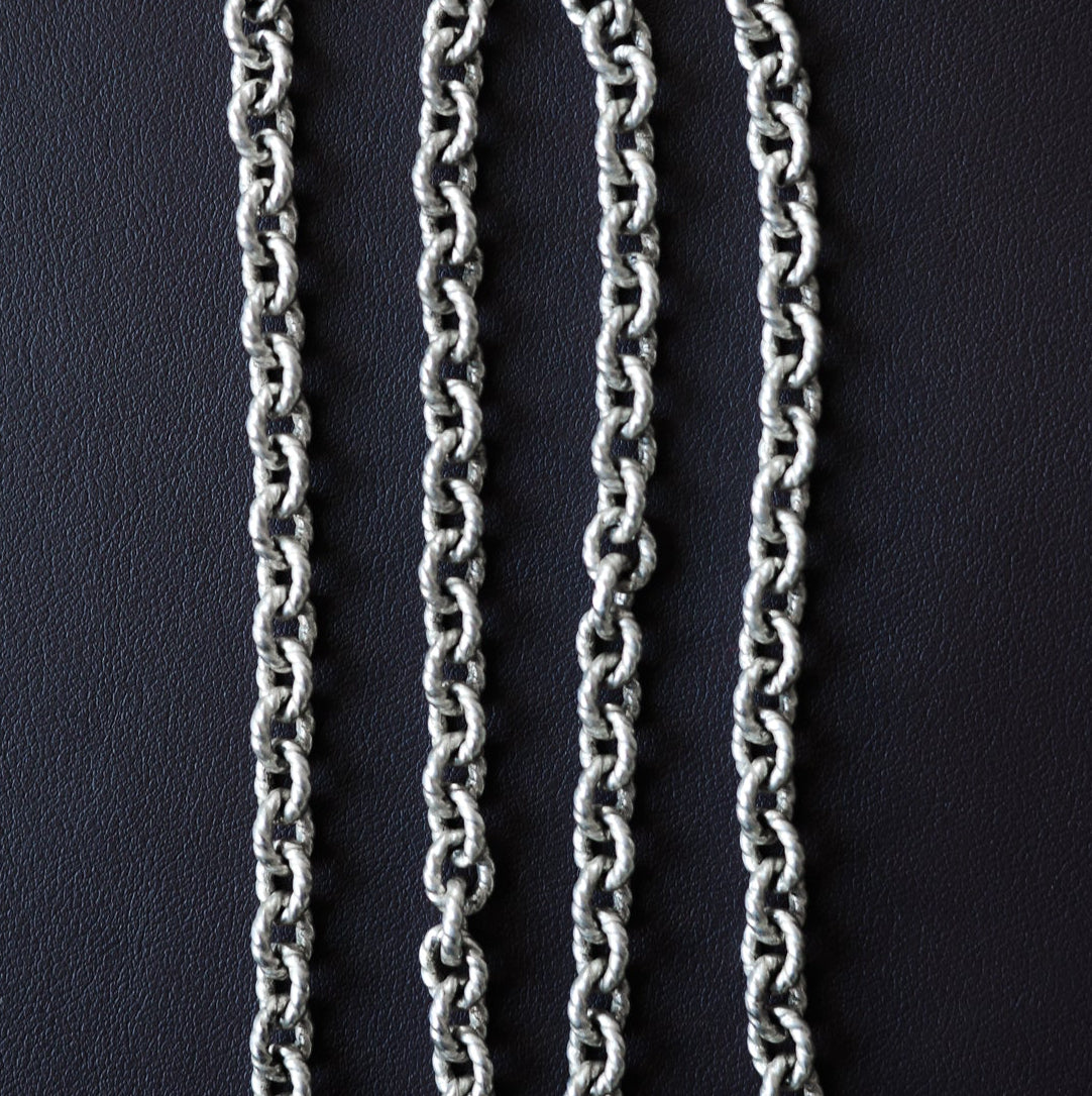 Twisted cable link chain