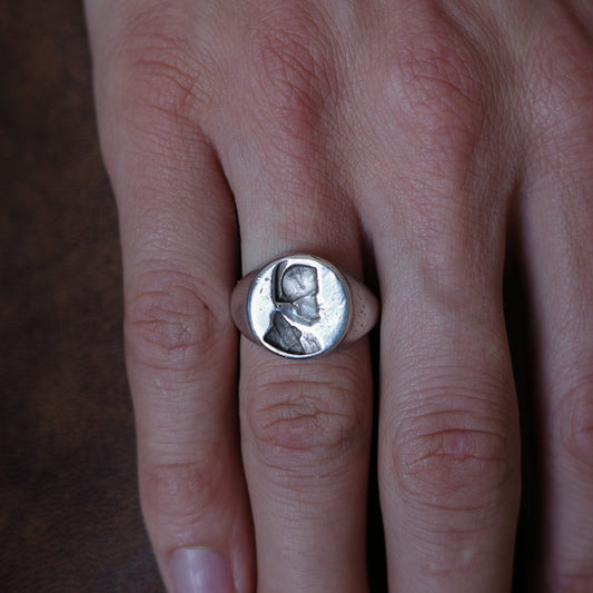 Embossed bust signet ring