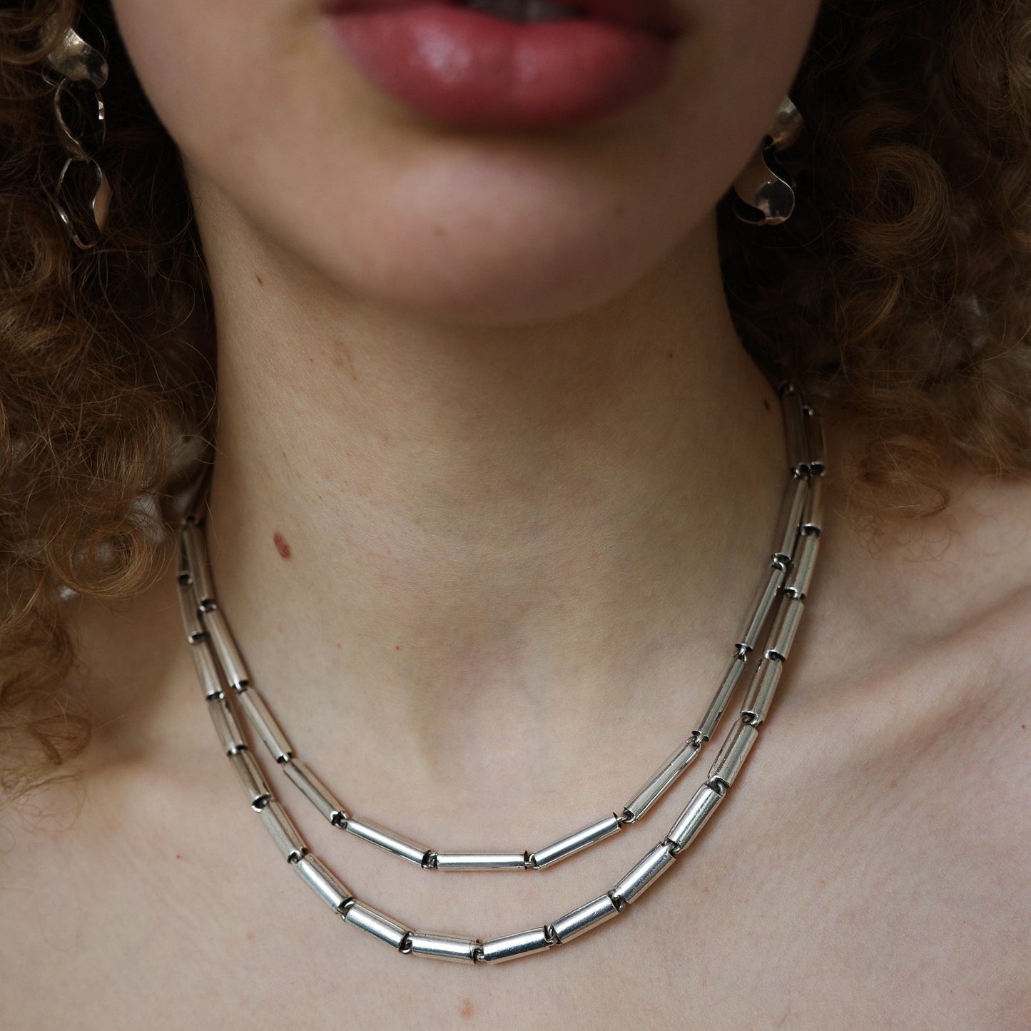 Double tube link chain