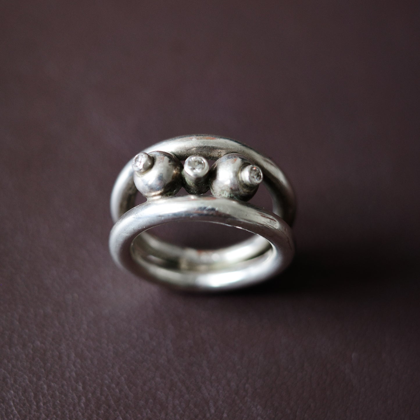 Studio-crafted three orbit ring