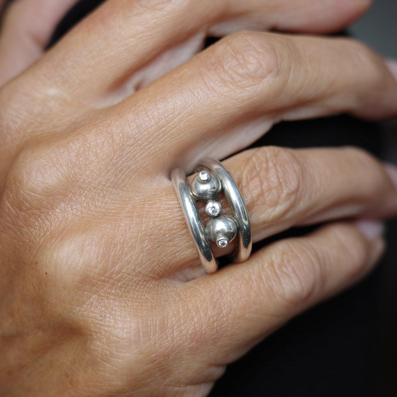 Studio-crafted three orbit ring