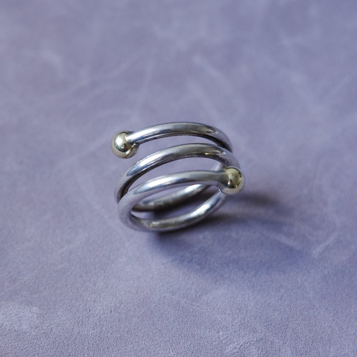 Spiral sterling ring with gold endings