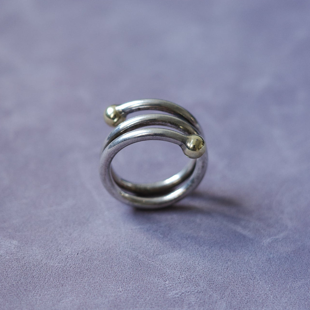 Spiral sterling ring with gold endings