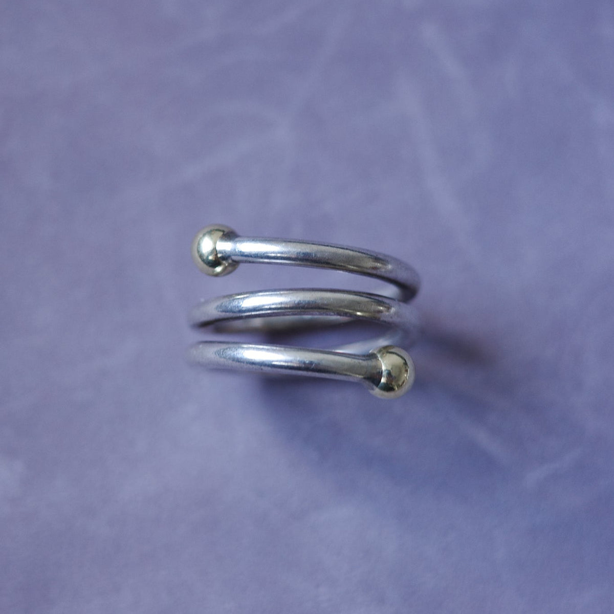 Spiral sterling ring with gold endings