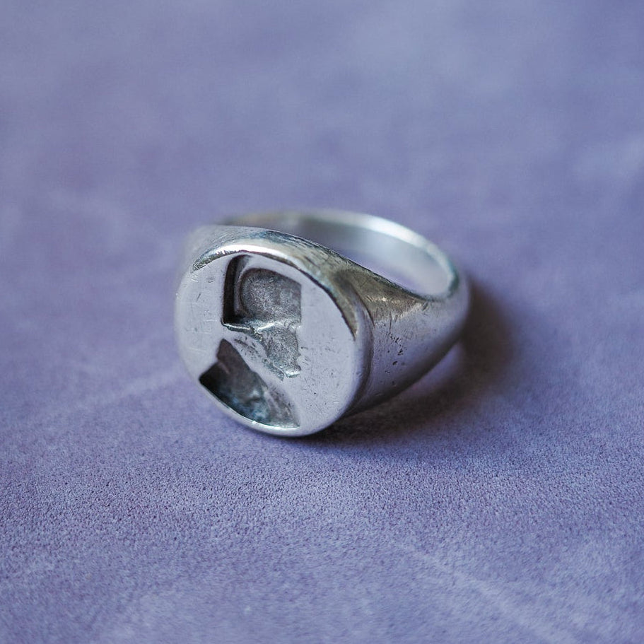 Embossed bust signet ring