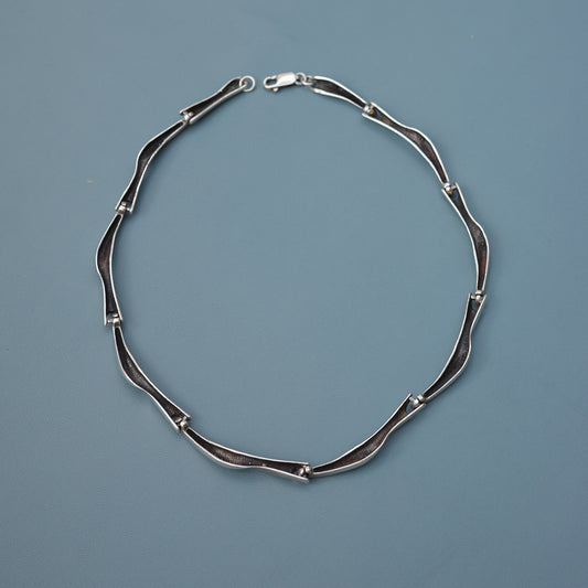 Reversible wave link chain